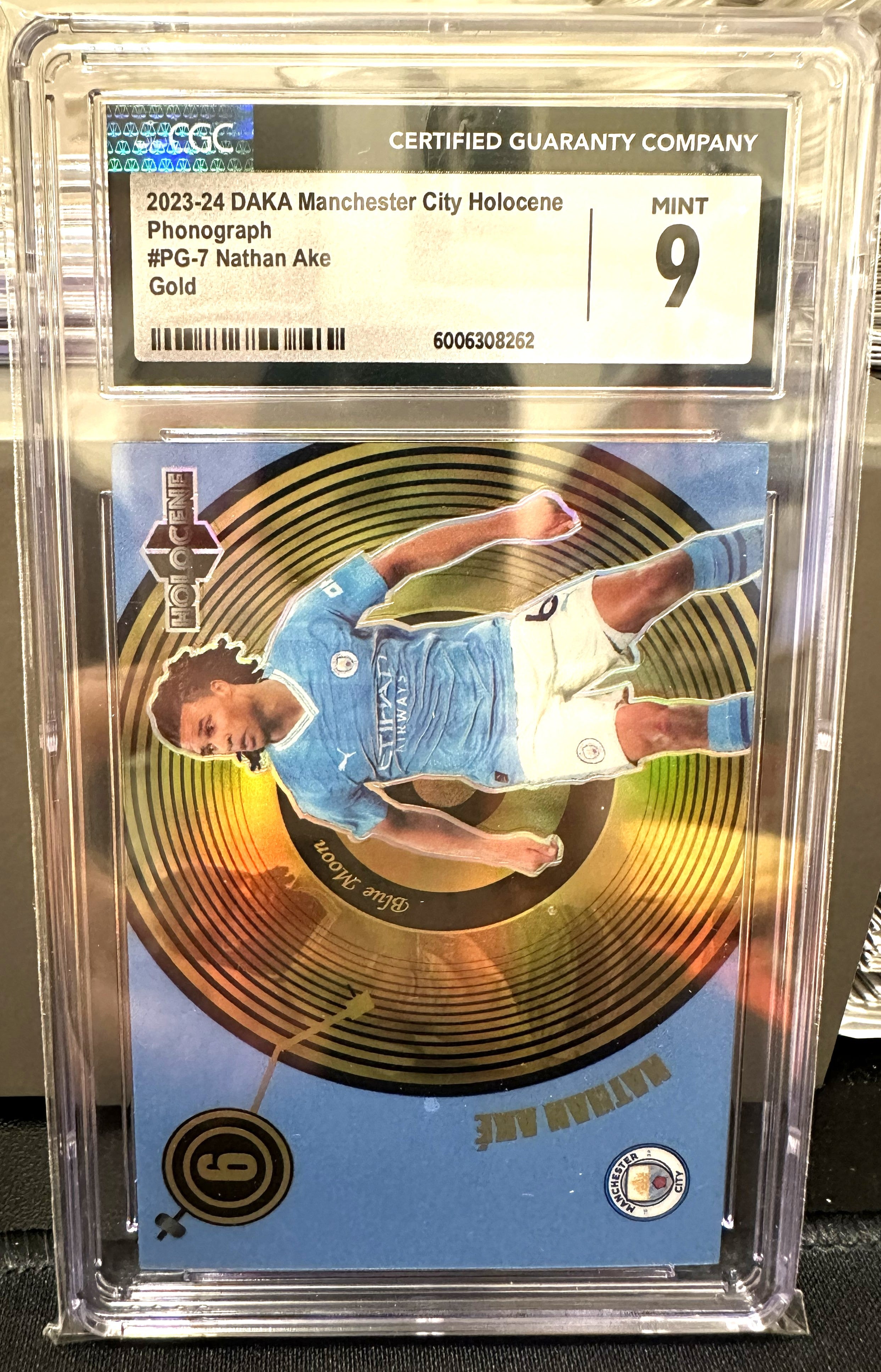 Nathan Ake 2023-2024 Daka Manchester City Holocene Phonograph (CGC MINT 9)
